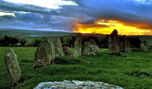 The triangular cup-marked stone